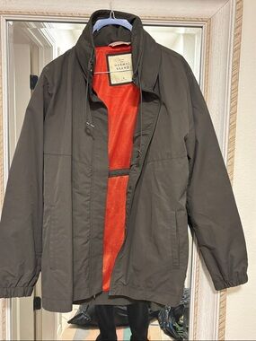 The Normal Brand dark green women’s  Lightweight Jacket with orange lining